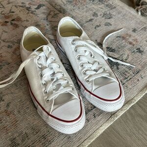 Woman’s white converse